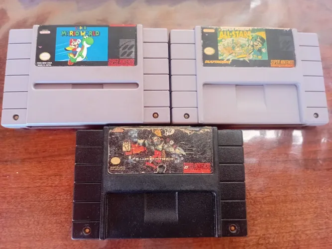 Lote com tres jogos de Super Nintendo funcionando mas Leia