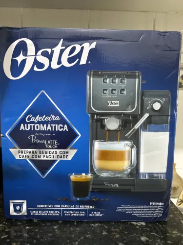 Cafeteira nova na caixa da Prima Latte da Oster com nota fiscal