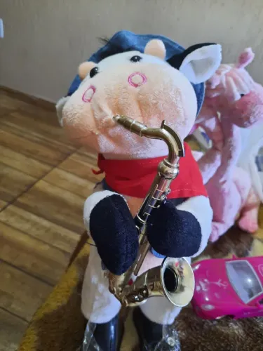 Vaquinha musical pelucia 