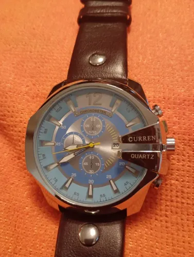 Relógio Curren m:8176 Coroa grande fundo azul pulseira em couro.