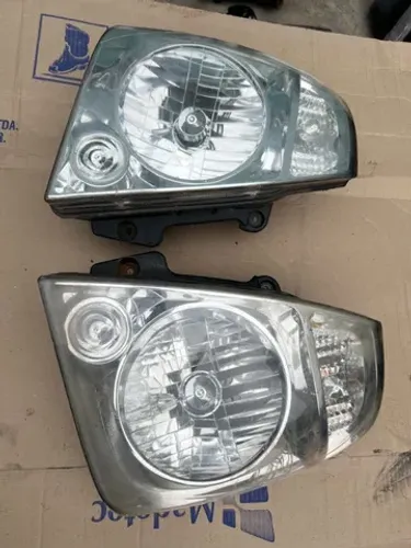 farol cromando kia bongo original (par)