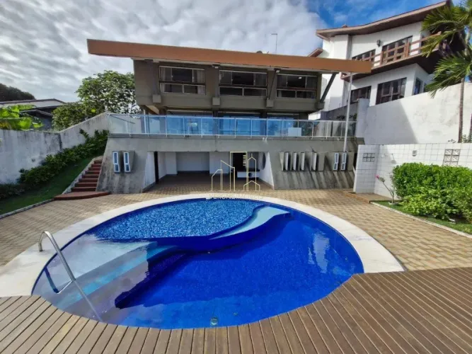 Belíssima casa em condomínio fechado com quatro suítes e área gourmet a venda no Horto Flo