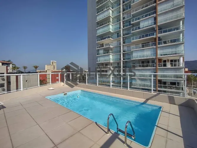 Apartamento com varanda e lazer na Praia da Enseada, Guaruja
