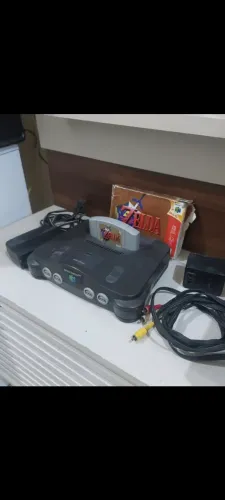 Nintendo 64 com Zelda controles, manuais e caixas