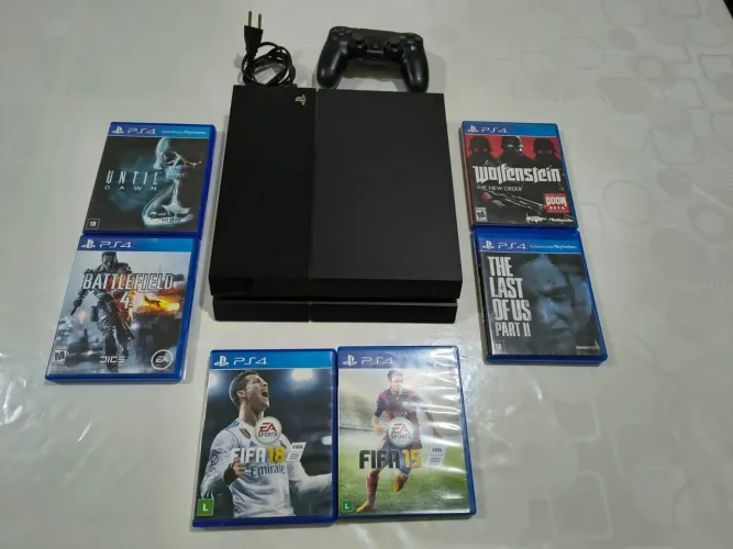 PlayStation 4 usado em ótimo estado + 6 jogos
