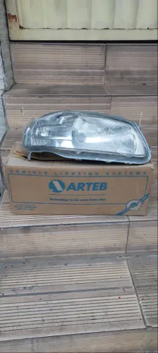 Farol Gol G4 cromado original lado direito novo