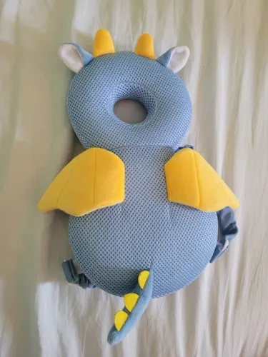 Suporte de Cabeça para Bebê - Dinossauro.