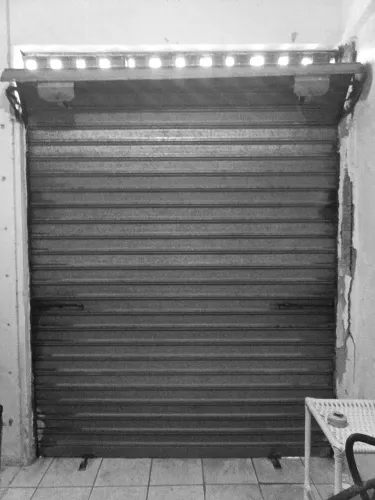 Porta de rolamento manual
