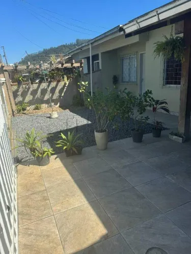 Geminado térreo em condomínio fechado Jardim das Flores no bairro Estrada Nova