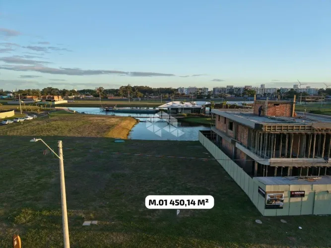 Terreno a beira lago no condomínio Lotus em Atlântida - Xangri-lá