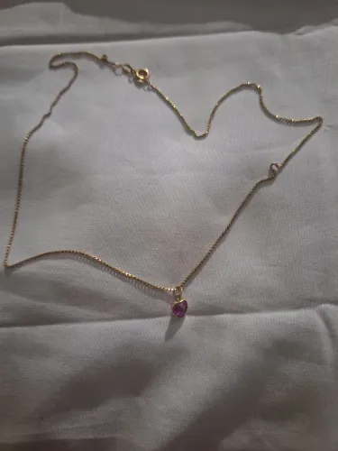 Cordão e pingente feminino de ouro 18k. Valor 1.000