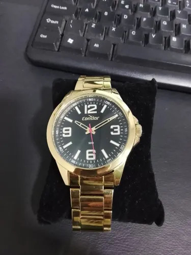 relogio marca condor  dourado fundo preto , na caixinha zeradinha com  garantia