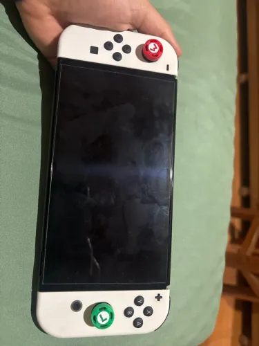 Nintendo Switch Oled + Jogos + Vários acessórios + Cartão Sd 256 gb