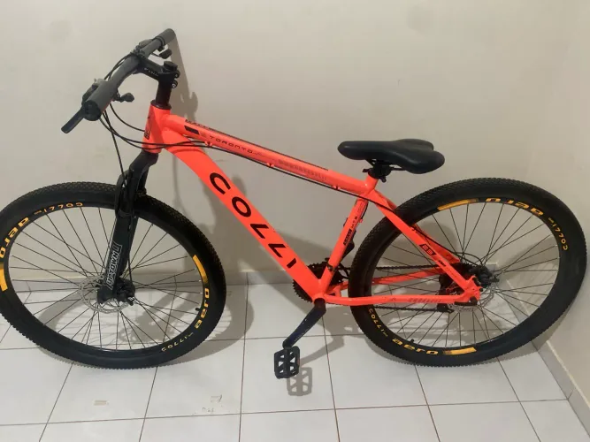 Bicicleta colli laranja aro 29