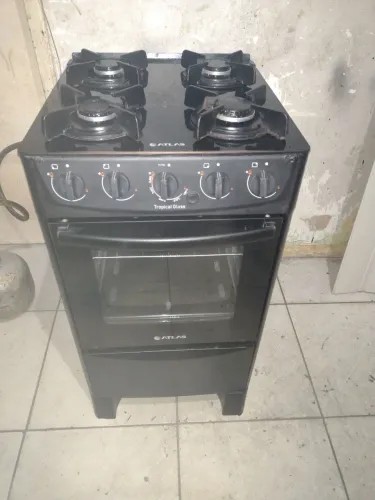 Fogão atlas 4 bocas todo de vidro praticamente novo pra hj temos entrega não e elétrico 