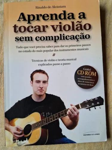 Aprenda tocar violão, livro acompanha caderno de partitura, ambos em bom estado