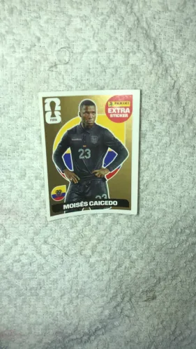 Figurinha dourada do Moisés caicedo copa 2026