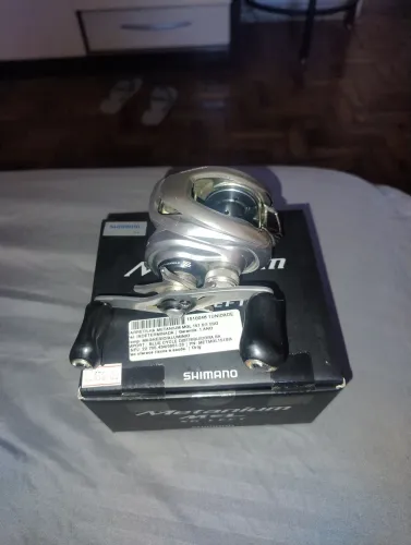 Carretilha Shimano Metanium MGL japonesa-Manivela esquerda