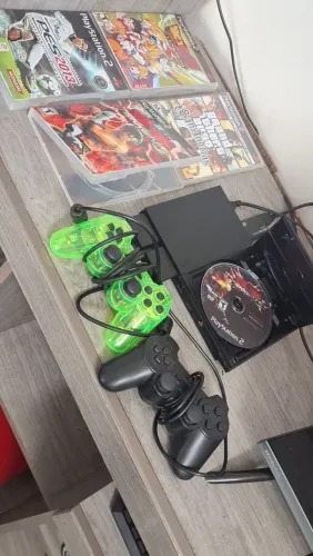 Ps2 slin dois controles memory card+ 4 jogos não originais