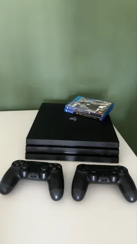 Ps4 pro + 2 controles + 2 jogos - completo