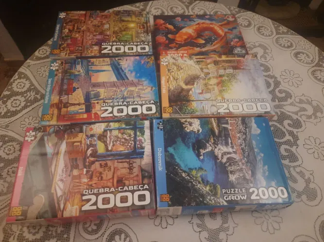 Lote de 6 quebra cabeça.5 de 2000 peças e 1 de 1000 peças