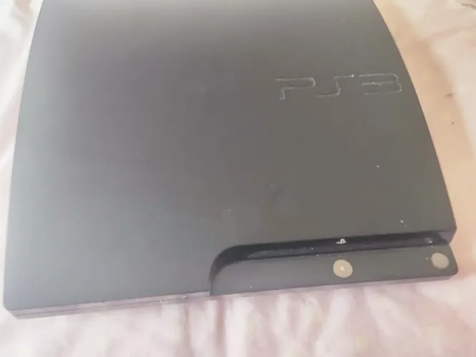PS3 com 1 controle e vários jogos