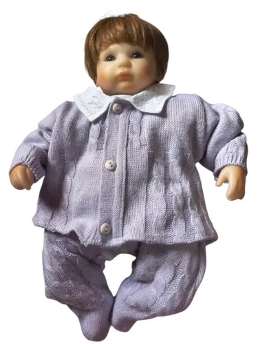 Boneco reborn corpo de pano olhos castanhos 45 cm.