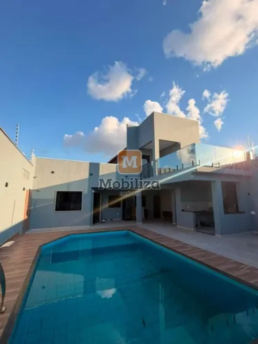 Sobrado sofisticado com 3 suítes, piscina, energia solar e ponto elétrico no bairro Aponiã