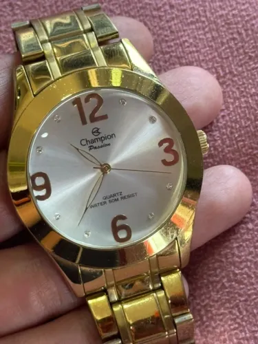 Relógio Champion Passion dourado com mostrador branco
