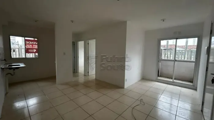 Apartamento à venda com sacada e churrasqueira.