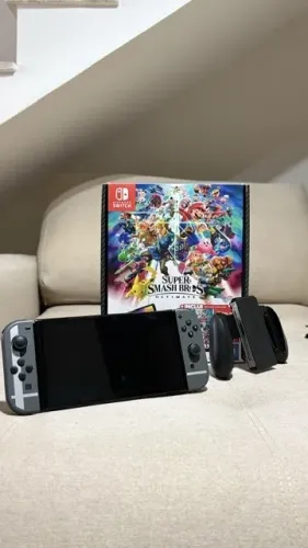 Nintendo Switch OLED Cinza Edição Smash Bros + Pokémon Brilliant Diamond