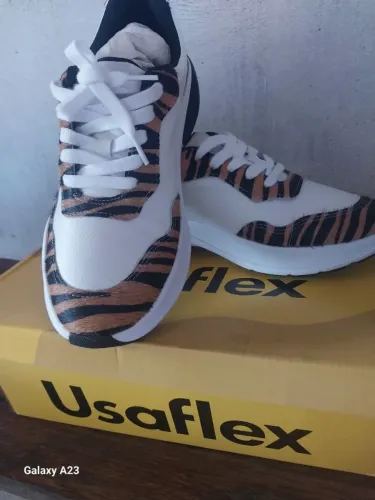 Tênis usa flex com pontos magnético