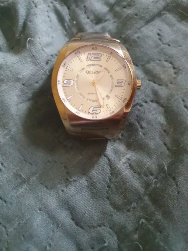 Relogio orient original vende longo dourado 