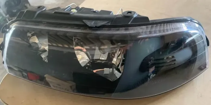 Farol Gol G3 lado esquerdo máscara negra 