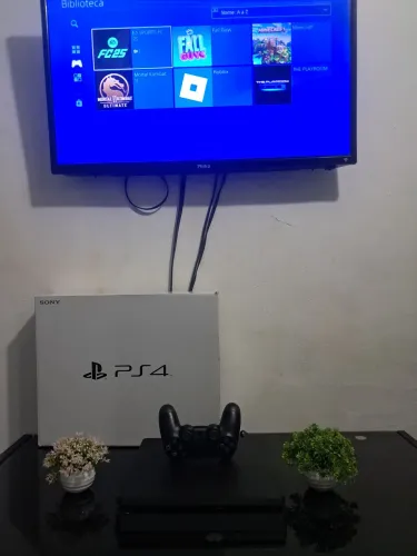 Ps4 slim original com 74 jogos pra vender logo