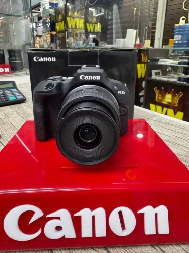 Cânon r100 + lente   1 ano de garantia 