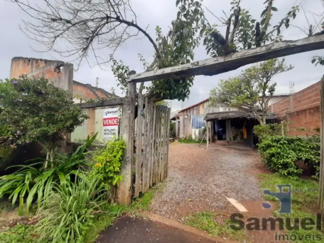 LOTE COM CASA BORDA DO CAMPO