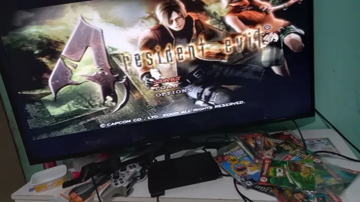 Playstation 2 com o leitor 100% e lotado de jogos!