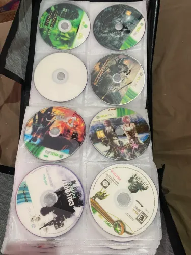 LOTE DE JOGOS PARALELOS DE XBOX 360 (LEIA) + PORTA CD PARA 520 discos