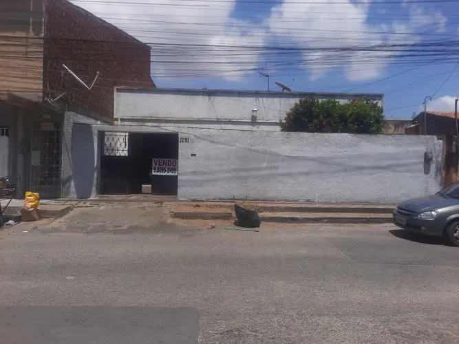 Vendo terreno com casa construída