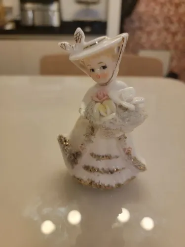 Boneca miniatura de Porcelana
