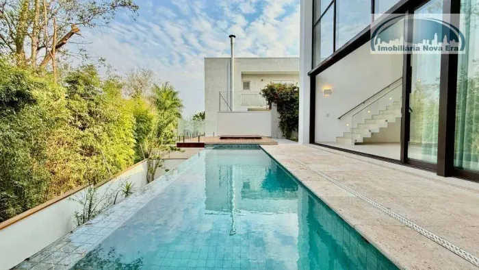 Casa com 5 dormitórios à venda, 429 m² por R$ 4.490.000,00 - Condomínio Reserva das Palmei