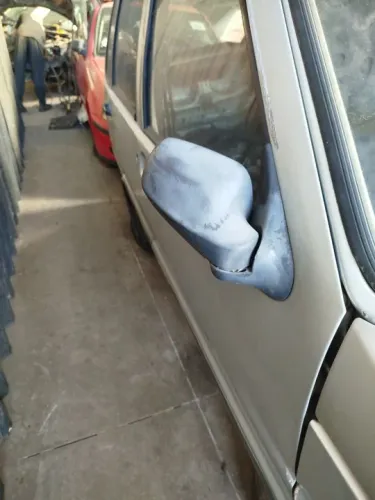 Espelho retrovisor direito uno 