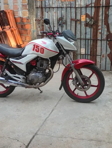 Vendo essa Titan mix 2013 quitada e selada