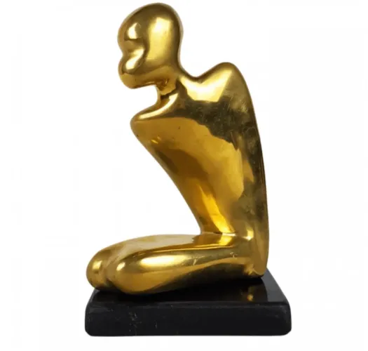 bronze - escultura em bronze maciço representando figura ajoelhada