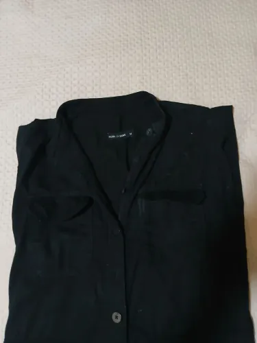 Macacão longo preto marca Riachuelo