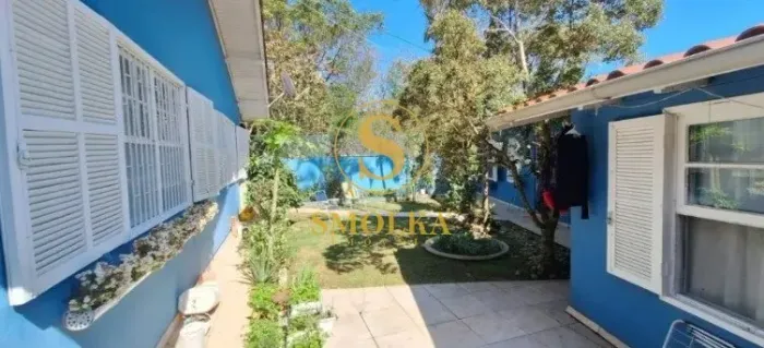 Casa à venda com 7 dormitórios, sendo 2 suítes, 4 vagas de garagem, no bairro Santa Mônica
