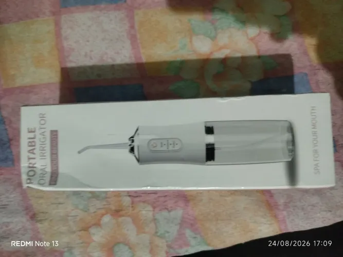 Portable oral irrigador