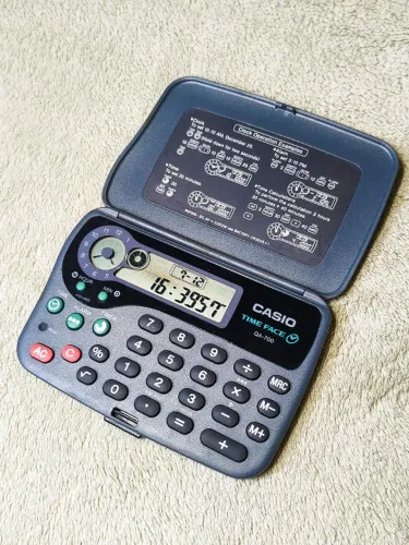 Calculadora Casio QA-700 Time Face de Bolso com Relógio - Raridade 1993