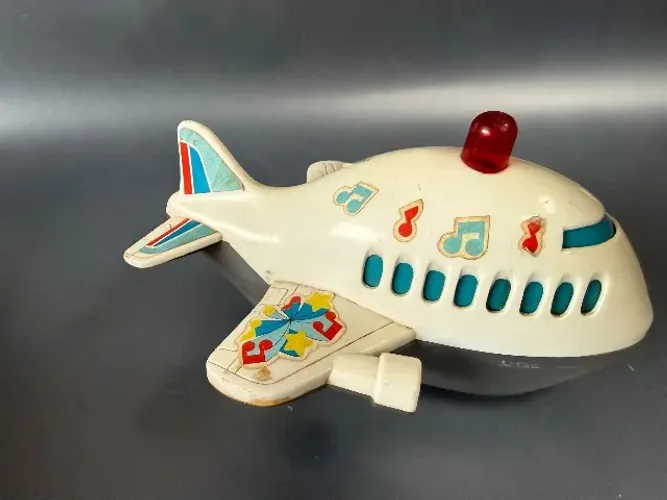 Brinquedo avião com notas musicais antigo